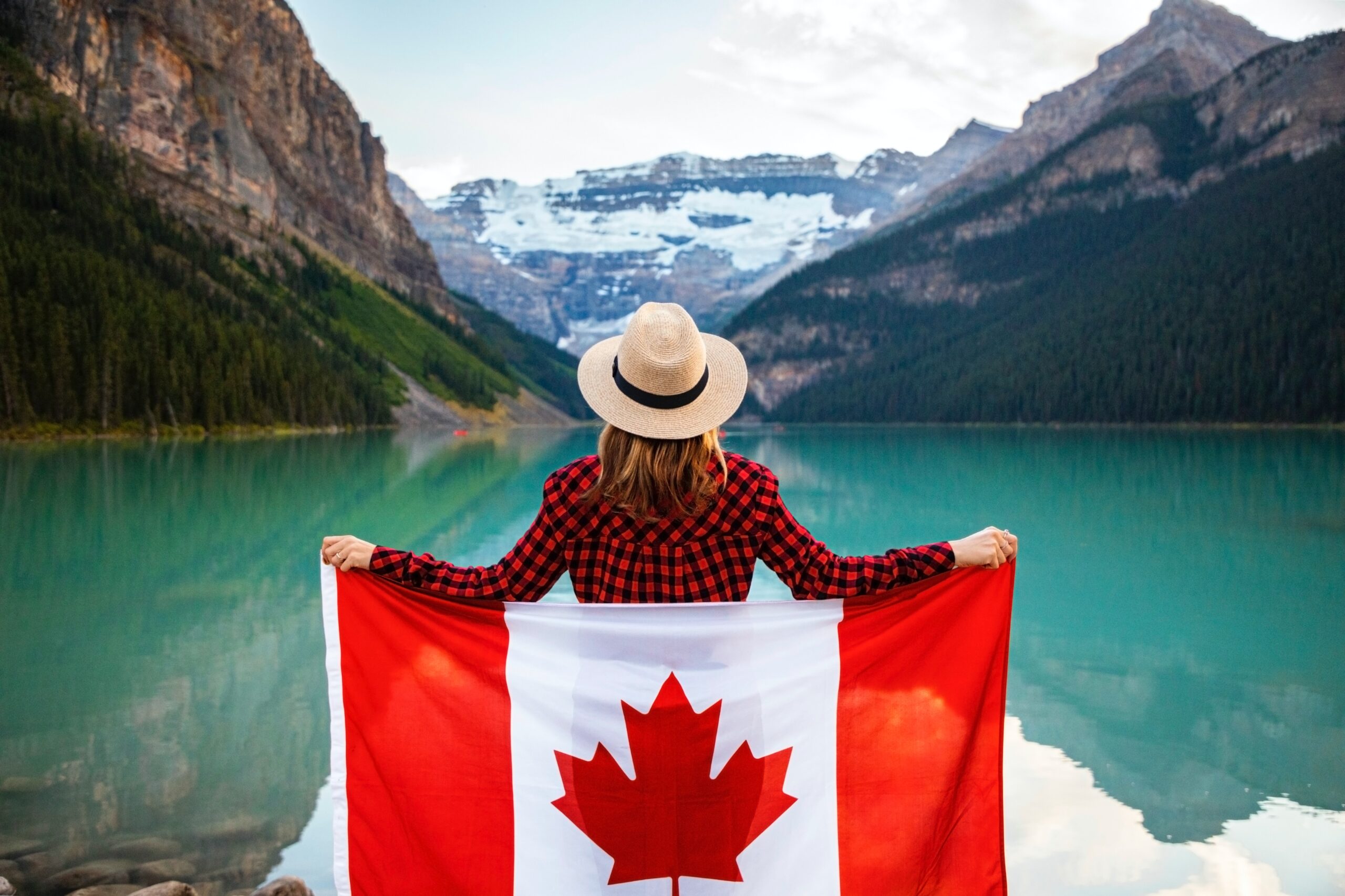Girl with Canadian flag - Get in to canada via PNP for immigration to Canada.